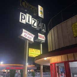 Exterior outside entrance of Chico's Pizza Parlor - Outside retro signage - Lynwood, California Exterior outside entrance of Chico's Pizza Parlor - Outside retro signage - Lynwood, California