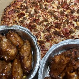 Oven Roasted Chicken Wings (Left) Honey Garlic and (Right) Spicy buffalo wings, CARNIVORE (Extra Large 16") Wings Oven Roasted Chicken Wings (Left) Honey Garlic and (Right) Spicy buffalo wings, CARNIVORE (Extra Large 16") Wings