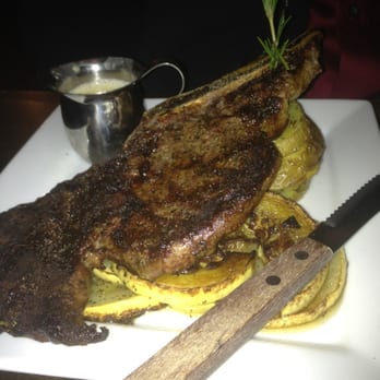 Petit Bistro - Bone-in ribeye with new potatoes and grilled squash - French Near Me - Bentonville, Arkansas Petit Bistro - Bone-in ribeye with new potatoes and grilled squash - French Near Me - Bentonville, Arkansas