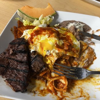 Alfredo's Cafe - Chilaquiles rojos with asada en over easy egg delicious good pricing great service I have tried all there menú and it's all great! - Breakfast & Brunch Near Me - Sun Valley, Nevada