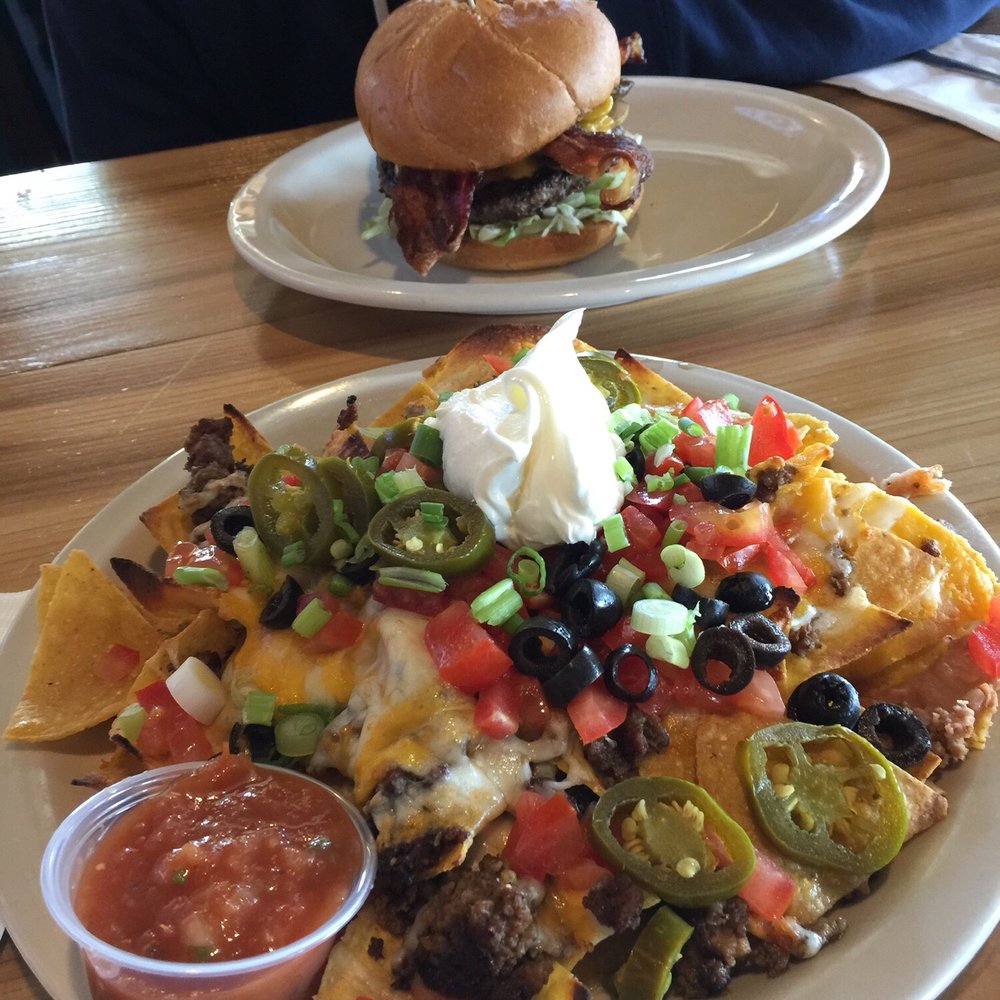 Wichita's Puff's Pub - The "mini nacho" from happy hour and my husbands jalapeño burger - Pubs Near Me - Gresham, Oregon Wichita's Puff's Pub - The "mini nacho" from happy hour and my husbands jalapeño burger - Pubs Near Me - Gresham, Oregon