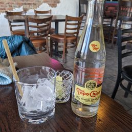Topo Chico, served chilled with optional ice, biodegradable straw, and lime slices. Topo Chico, served chilled with optional ice, biodegradable straw, and lime slices.
