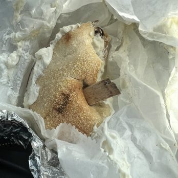 Bagel Pub - Pulling the stick out as it was jammed in the bread - Bagels Near Me - New York, New York Bagel Pub - Pulling the stick out as it was jammed in the bread - Bagels Near Me - New York, New York