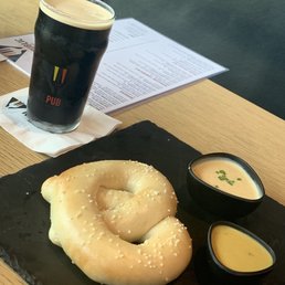 Homemade Pub Pretzel with mustard and cheese dipping sauce. Homemade Pub Pretzel with mustard and cheese dipping sauce.