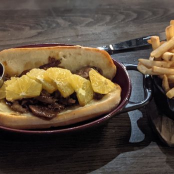 Brick & Bourbon - Duck Philly with fries. - New American Near Me - Maple Grove, Minnesota Brick & Bourbon - Duck Philly with fries. - New American Near Me - Maple Grove, Minnesota