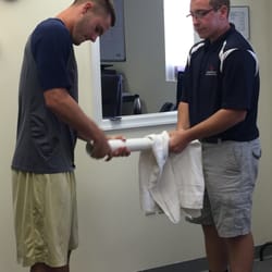 McKenzie Sports Physical Therapy - Our summer intern Matt working with one of our patients. (wrist roller technique)
