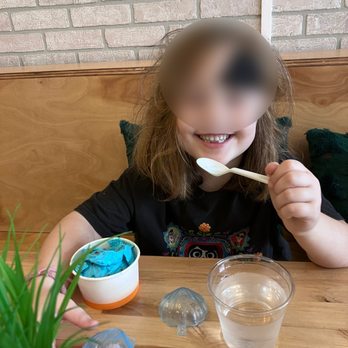 La Mocha Cafe - A happy 5 year old eating her Cookie Monster ice cream. - Coffee & Tea Near Me - Lakewood, Ohio