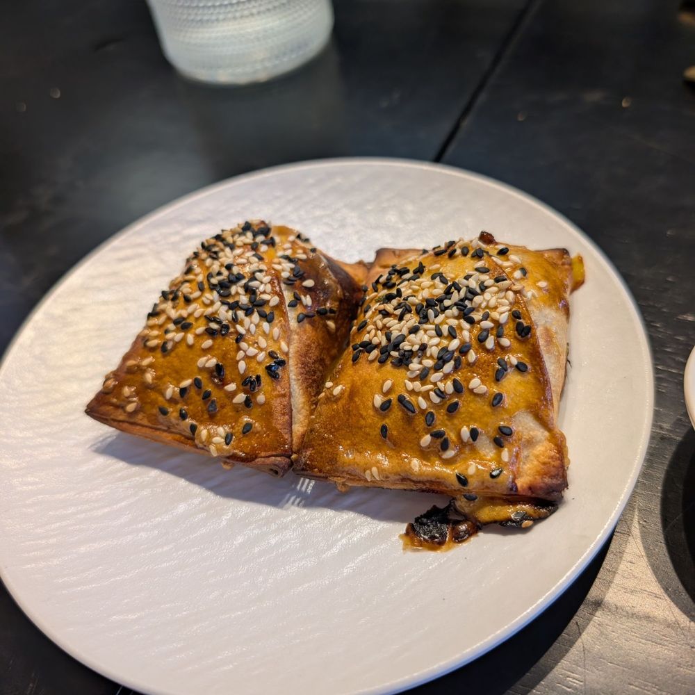 Kusan Bazaar | Silk Road Grill & Noodles 龟兹集市 - Samsa (2 piece per serve) 新疆烤包子 Lamb, Onions, Black Peppers, Salt, Sesame - Halal Near Me - Mountain View, California Kusan Bazaar | Silk Road Grill & Noodles 龟兹集市 - Samsa (2 piece per serve) 新疆烤包子 Lamb, Onions, Black Peppers, Salt, Sesame - Halal Near Me - Mountain View, California