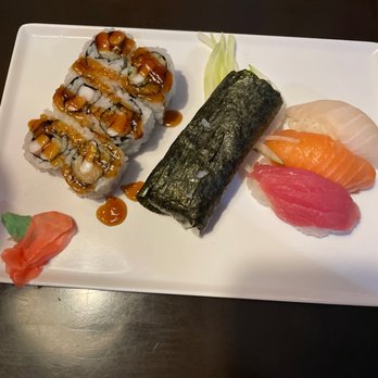Sakura Japanese Restaurant - Avocado roll flanked by squid roll and Tuna, salmon, Red snapper - Sushi Bars Near Me - Chesapeake, Virginia Sakura Japanese Restaurant - Avocado roll flanked by squid roll and Tuna, salmon, Red snapper - Sushi Bars Near Me - Chesapeake, Virginia