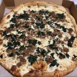 Antonio's Pizzeria - White pizza with added spinach and sausage.