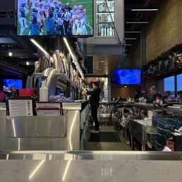 Bar area with lighted keg room above Bar area with lighted keg room above