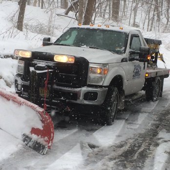 Blue Mist Landscape Irrigation - a snow plow on a snowy road - Landscaping Near Me - Pompton Lakes, New Jersey Blue Mist Landscape Irrigation - a snow plow on a snowy road - Landscaping Near Me - Pompton Lakes, New Jersey