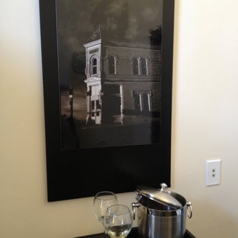 Trinity Hotel Restaurant - A nice framed print of the hotel's exterior with the wine tools (wine fridge is on the desk to the right of this shot). - Hotels Near Me - Carlsbad, New Mexico Trinity Hotel Restaurant - A nice framed print of the hotel's exterior with the wine tools (wine fridge is on the desk to the right of this shot). - Hotels Near Me - Carlsbad, New Mexico