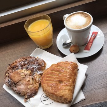 Eric Kayser - Chocolate and almond croissant, apple turnover, latte, and orange juice - Bakeries Near Me - Paris, 75 Eric Kayser - Chocolate and almond croissant, apple turnover, latte, and orange juice - Bakeries Near Me - Paris, 75
