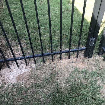 Nature Scapes - a fence with a black gate - Landscaping Near Me - Lilburn, Georgia Nature Scapes - a fence with a black gate - Landscaping Near Me - Lilburn, Georgia
