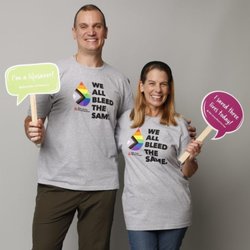 New Jersey Blood Service - Freehold Donor Center - Freehold Donors wearing t-shirts reading "We All Bleed the Same" and holding signs that read "I'm a Lifesaver" and "I Saved T...
