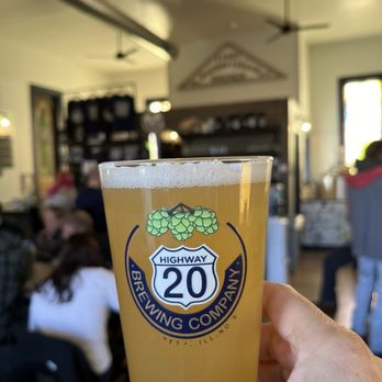 Highway 20 Brewing Company - a hand holding a pint of beer - Brewpubs Near Me - Elizabeth, Illinois Highway 20 Brewing Company - a hand holding a pint of beer - Brewpubs Near Me - Elizabeth, Illinois