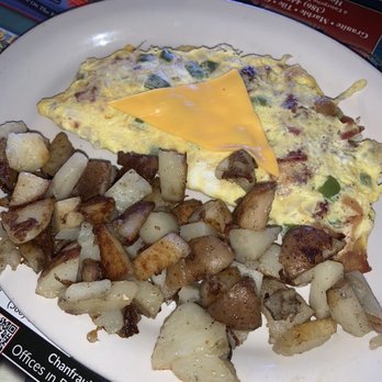 Friends Cafe - The "Mess" omelette with potatoes on the side.  Yummy! - Diners Near Me - Flagler Beach, Florida