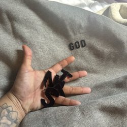 Hidden Hype Boutique - The felt lettering that came off. Only thing that stayed was the word "god".