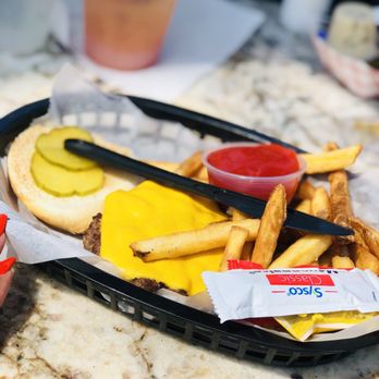 Rick's On the River - 1/4 Lb . Hamburger with Cheese (watered down rum runner in back) - New American Near Me - Tampa, Florida Rick's On the River - 1/4 Lb . Hamburger with Cheese (watered down rum runner in back) - New American Near Me - Tampa, Florida