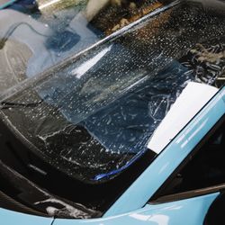 TR3 Performance - Xpel windshield protection being installed on a lamborghini revuelto at tr3 performance in south florida