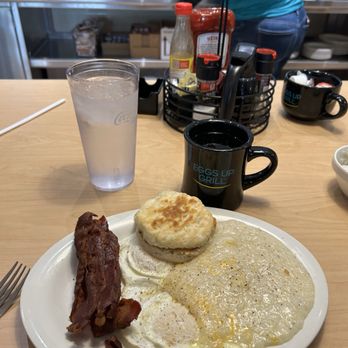 Eggs Up Grill - The Classic with bacon, biscuit, over medium eggs, and cheese grits (which I'm compelled to dump from the bowl ). - Breakfast & Brunch Near Me - Apopka, Florida Eggs Up Grill - The Classic with bacon, biscuit, over medium eggs, and cheese grits (which I'm compelled to dump from the bowl ). - Breakfast & Brunch Near Me - Apopka, Florida