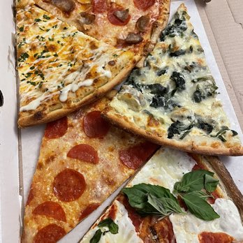 Rosalia's Pizzeria - Assorted slices - Pizza Near Me - Forest Hills, New York Rosalia's Pizzeria - Assorted slices - Pizza Near Me - Forest Hills, New York