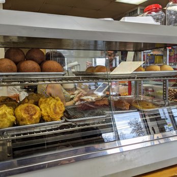 Las Americas Cafe - Ready-made hot item display 2 of 2. Not sure what these were. Croquettas, perhaps? Blood sausage, empanadas, some sort of breads/rolls. - Cafes Near Me - Doraville, Georgia Las Americas Cafe - Ready-made hot item display 2 of 2. Not sure what these were. Croquettas, perhaps? Blood sausage, empanadas, some sort of breads/rolls. - Cafes Near Me - Doraville, Georgia