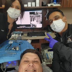 Southshore Dental - Dr. Patel (R) and Raquel (L) working on my implants.