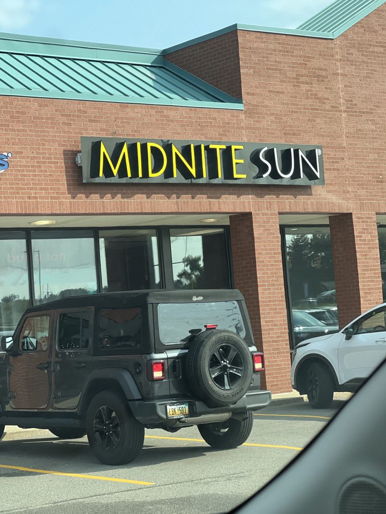 Midnite Sun - Grand Rapids Cascade Crossings Logo