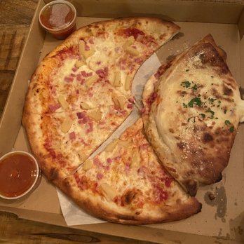 Amano - Pineapple and ham in the pizza and sausage and onion in the calzone - Pizza Near Me - Las Vegas, Nevada Amano - Pineapple and ham in the pizza and sausage and onion in the calzone - Pizza Near Me - Las Vegas, Nevada