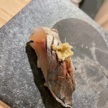 Sushi Aki - a piece of sushi on a slate plate - Japanese Near Me - Honolulu, Hawaii