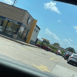 Church's Chicken - Lobby "closed". Strictly drive thru with multiple cars awaiting service.