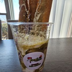 Cecy's Chicken - Flautas de pollo served in salsa verde, sour cream, cheese, and red cabbage