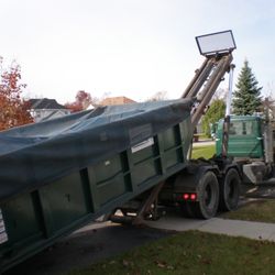 ARS Dumpster Rental - 20 yard dumpster rolling off truck.