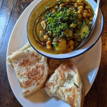 Nue - Trinidadian curried channa and aloo $20 - Tapas/Small Plates Near Me - Seattle, Washington Nue - Trinidadian curried channa and aloo $20 - Tapas/Small Plates Near Me - Seattle, Washington