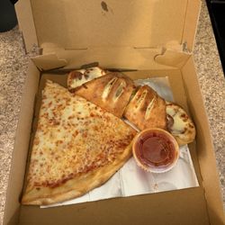 Renzo's Pizza & Restaurant - Regular slice and a sausage roll.