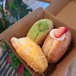 Matcha, strawberry milkshake, passionfruit mango donuts Matcha, strawberry milkshake, passionfruit mango donuts