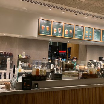 Starbucks - a coffee shop counter with menus on the wall - Coffee & Tea Near Me - Longview, Texas