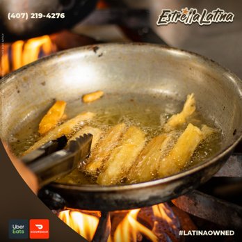 Estrella Latina - frying fish in a frying pan - Latin American Near Me - Orlando, Florida Estrella Latina - frying fish in a frying pan - Latin American Near Me - Orlando, Florida