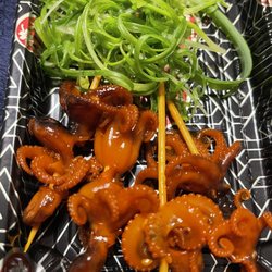 Sam Ramen - Baby tako skewers with green onion garnish