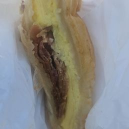 Half of my egg and bacon croissant sandwich. Half of my egg and bacon croissant sandwich.