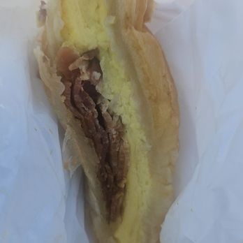 Sam's Donuts - Half of my egg and bacon croissant sandwich. - Donuts Near Me - San Jose, California Sam's Donuts - Half of my egg and bacon croissant sandwich. - Donuts Near Me - San Jose, California
