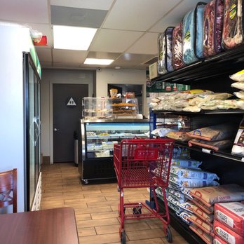 India Express - Sweet & Spice - Front counter area showing cheeses and cookies. - Indian Near Me - Fowler, California