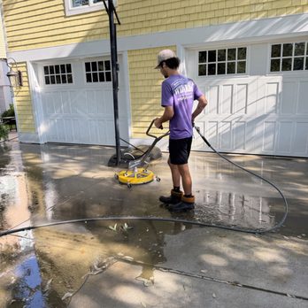 Window Cleaning Wizards - We power washed a driveway in Wrightsville Beach NC. Removing algae and grime now protects the concrete from long-term staining. - Window Washing Near Me Window Cleaning Wizards - We power washed a driveway in Wrightsville Beach NC. Removing algae and grime now protects the concrete from long-term staining. - Window Washing Near Me