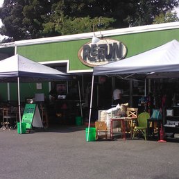 With green walls, green signs, green pails, and big green trees, "rerun" could imply "recycle, reduce, reuse!"