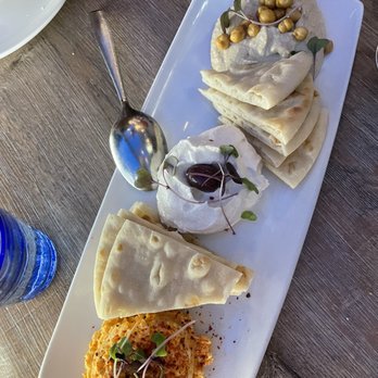 Avli River North - spicy feta, whipped fish roe and hummus dips - Greek Near Me - Chicago, Illinois Avli River North - spicy feta, whipped fish roe and hummus dips - Greek Near Me - Chicago, Illinois
