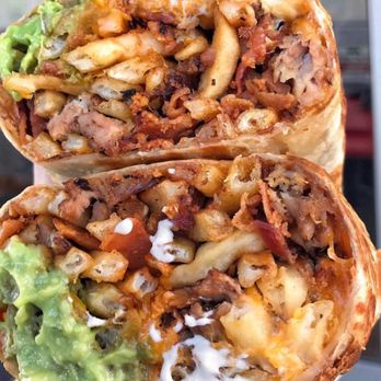 Man vs Fries - a hand holding a burrito - Food Delivery Services Near Me - Miami, Florida Man vs Fries - a hand holding a burrito - Food Delivery Services Near Me - Miami, Florida