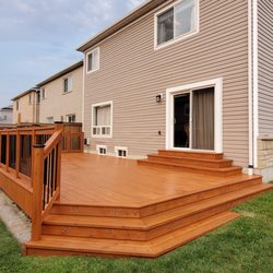 O'Reilly Renos & Decks - Refinished deck and one happy Customer
