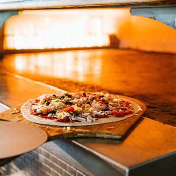 PYRO'S Fire Fresh Pizza - a pizza cooking in an oven - Pizza Near Me - Cordova, Tennessee PYRO'S Fire Fresh Pizza - a pizza cooking in an oven - Pizza Near Me - Cordova, Tennessee